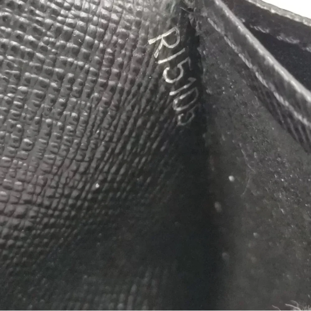 Louis Vuttton Damier Graphite wallet.